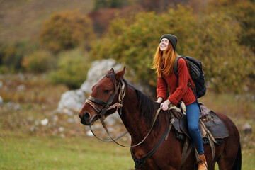 Fototapeta premium pretty woman in nature walk fun horse with travel