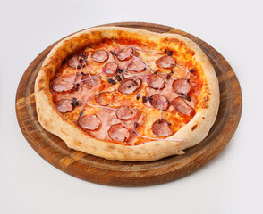 Top view of hot pizza on a wooden stand.