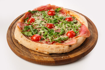 Top view of hot pizza on a wooden stand.