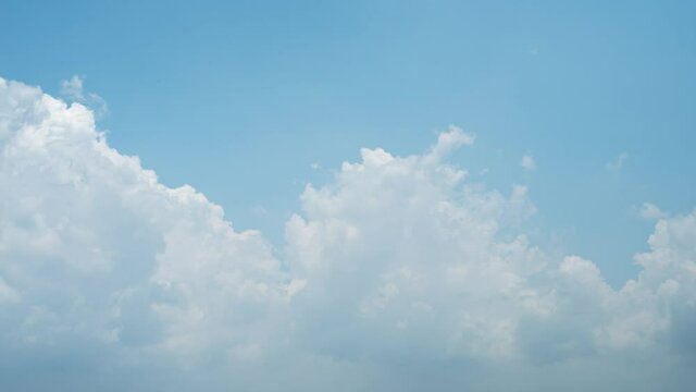 Blue sky white clouds. Puffy fluffy white clouds. Cumulus cloud cloudscape timelapse. Summer blue sky time lapse. Nature weather blue sky. White clouds background. Cloud time lapse