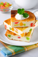 Cottage cheese casserole or pudding with candied pineapples close-up. Russian breakfast food, zapekanka.