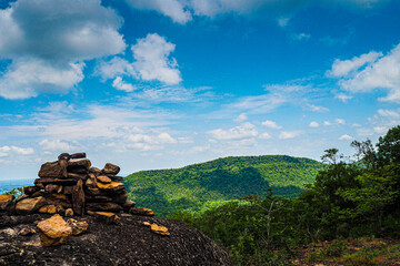 landscape view with blue sky or black sky, mountain ,green forest and rock 