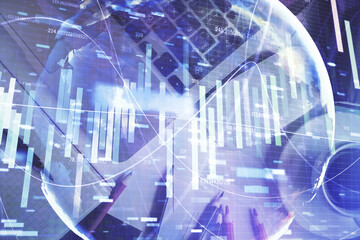 Business theme hologram drawings over computer on the desktop background. Top view. Multi exposure. Concept of international connections.