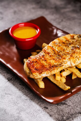 Chicken steak. Served with honey-mustard sauce.
