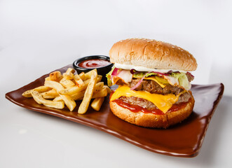 Burger. Juicy pork cutlet, cheddar cheese, crispy pickled onions, lettuce wrapped in a bun under two sauces. Served with french fries