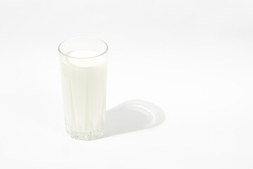 Obraz na płótnie Canvas a glass of milk on a white background. Milk Day