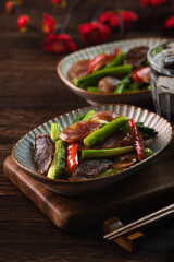 Delicious spicy homemade stir-fried Chinese smoked sausage with asparagus.
