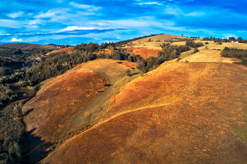 Barren landscape of Zlatibor mountain hill slopes in autumn sunset
