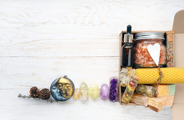 Gift box with wax candles, soap, sea salt, palo santo, spa bottle with herbs and minerals. energy...