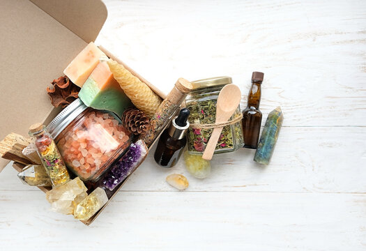 Gift box with wax candles, soap, sea salt,  spa bottle with healthy herbs, gemstones minerals. energy relaxing set for Crystal ritual, spiritual practice, body care. Wiccan Witchcraft. 