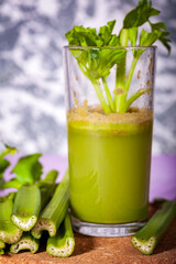 Healthy Celery diet for the treatment of incurable mysterious diseases. Fresh celery juice squeezed out on a juicer.drink, vegetable juice, studio shot