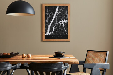 Stylish dining room interior with mock up poster map, wooden walnut table,  design chairs, cup of...