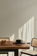 Minimalist concept of dining room interior with wooden family table, design chairs, cup of coffee,...