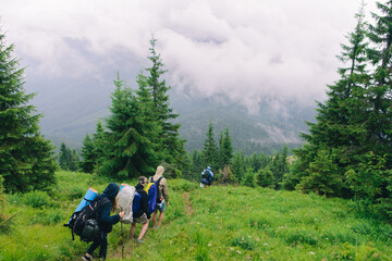 People Hiking Mountain Trail Path at Foggy Day