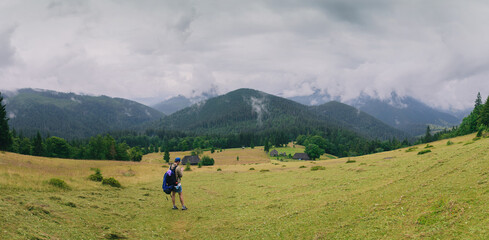 People Hiking Mountain Trail Path at Foggy Day