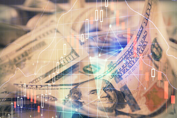Double exposure of forex graph drawing over us dollars bill background. Concept of financial markets.