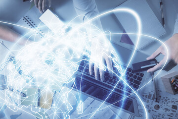 Double exposure of man and woman working together and business theme hologram drawing. Computer background. Top View.