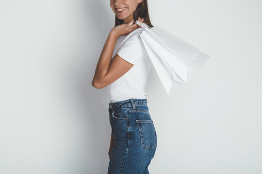  Cropped image of young woman in jeans and blank white t-shirt