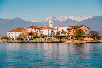 Fototapeta na wymiar Borromee island on Lake Maggiore seen from the boat carrying tourists