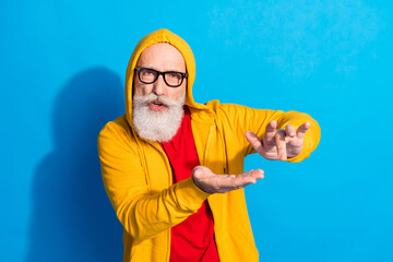 Photo of mature handsome funky funny good mood grandfather in glasses dancing isolated on blue color background