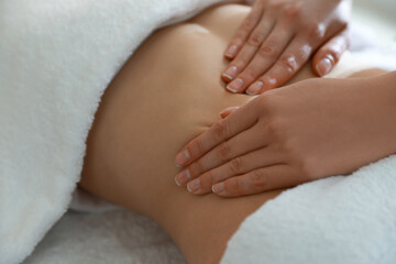 Fototapeta na wymiar Woman receiving professional belly massage, closeup view