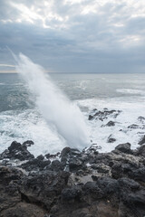 waves crashing on rocks