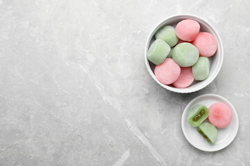 Delicious mochi on light grey marble table, flat lay with space for text. Traditional Japanese dessert