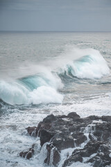 Great wave of Kanagawa and black rocks