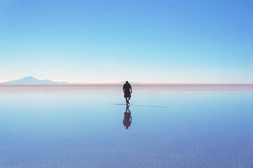 man walks on water. loneliness concept. landscape with a man in the center of the lake.