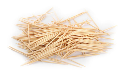 Heap of wooden toothpicks on white background