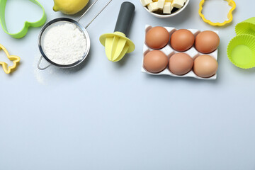 Cooking utensils and ingredients on light background, flat lay. Space for text