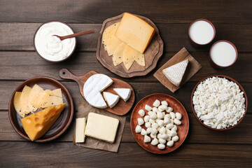 Flat lay composition with dairy products on wooden table