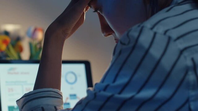 Young asian lady employee work overtime late night stress finance accounting project research on laptop at home. Girl student learn online at house, Social Distance, New normal work from home concept.
