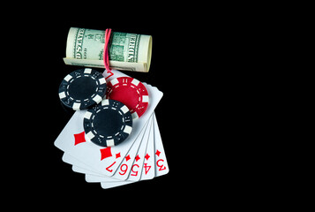 Poker game with straight flush combination and money. Chips and cards on the black table. Winnings in poker