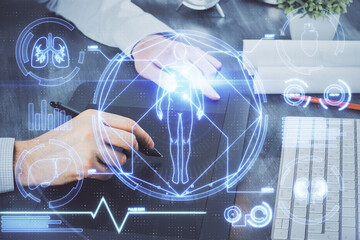 Double exposure of man's hands holding and using a phone and education theme drawing.