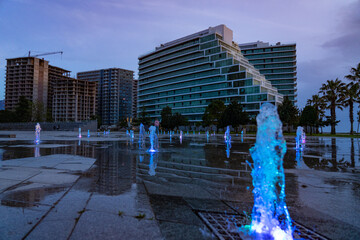 Batumi, Georgia - April 28, 2021: Fountain on the new boulevard during sunset