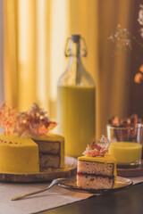 Delicious white and yellow minimalist decorated cakes, coffee milk beverages and liquor