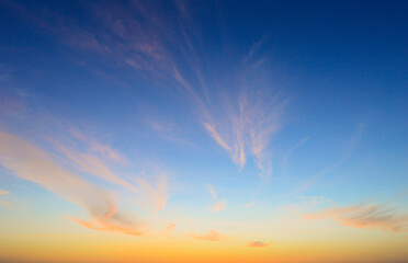 Beautiful sky painted by the sun leaving bright golden shades.Dense clouds in twilight sky in...