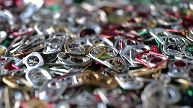 multicolored Metal pull ring of can. Recycling concept