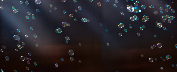 colorful blurred soap bubbles on a dark background