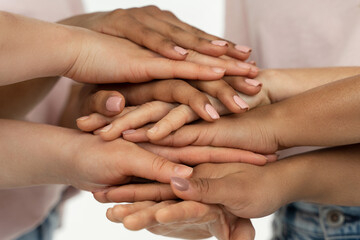 Different ethnicity female hands. Multicultural diversity and friendship.