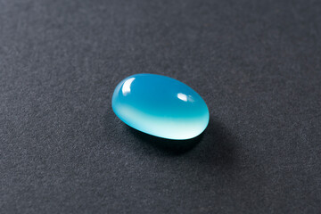 Natural baby blue chalcedony oval cabochon polished gemstone. Heated, color enhanced, increased...