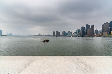 Beautiful view of the Hudson River under the cloudy sky in Manhattan, New York City, USA