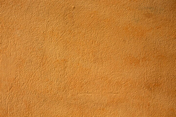 close-up of orange  painted cement wall