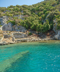Fototapeta na wymiar Kekova is an island that under the water preserves the ruins of 4 ancient cities.Under the water are visible port facilities