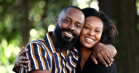 Two beautiful black African couple hugging together - Powered by Adobe