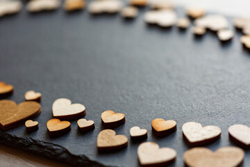 Wooden hearts in retro style as concept of love
