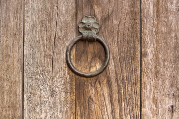 old dark wooden door with iron handles