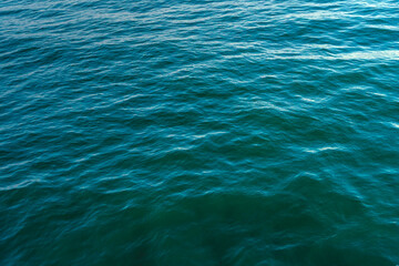 Fototapeta na wymiar Blue ocean close-up, calm waves, background image