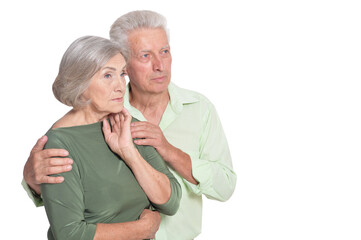 Portrait of sad senior couple isolated